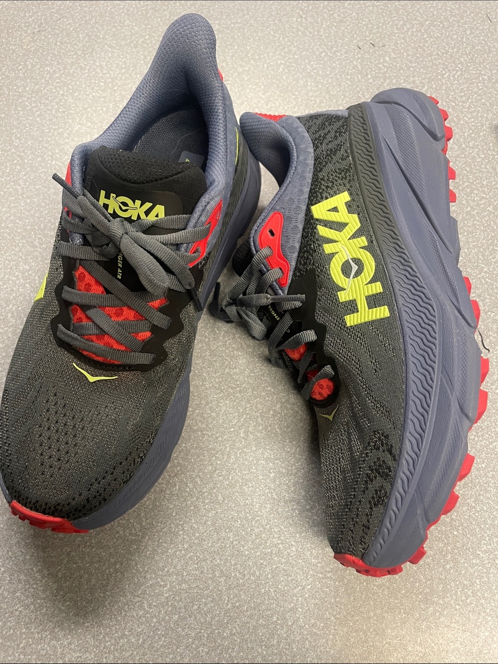 Hoka Black Trail Running Shoes with Yellow Logo and Red Accents